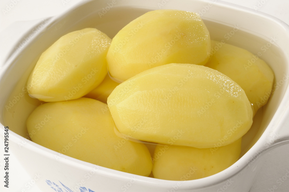 peeled potatos in a bowl peeled potatos in a bowl
