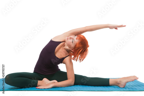 Girl practicing yogatic asana photo