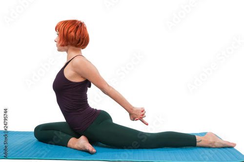 Girl practicing yogatic asana photo