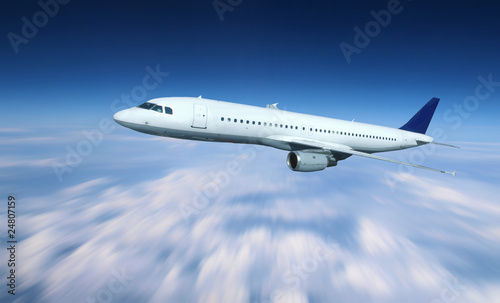 Airplane above clouds with blur background