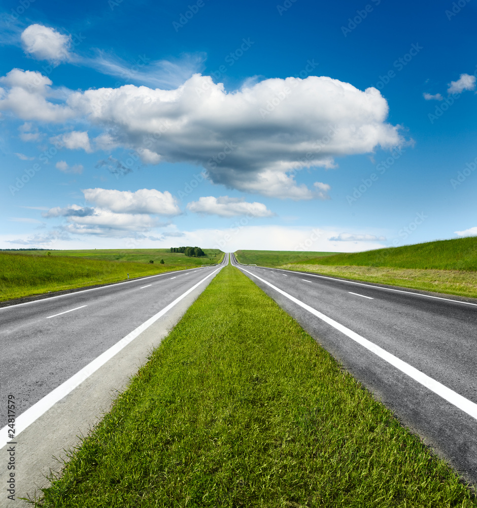 landscape with road and cloudy blue sky