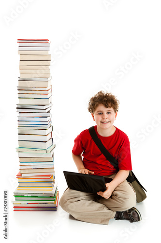 Student sitting close to pile of books on white