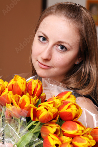 attractive blonde holding bunch of flowers