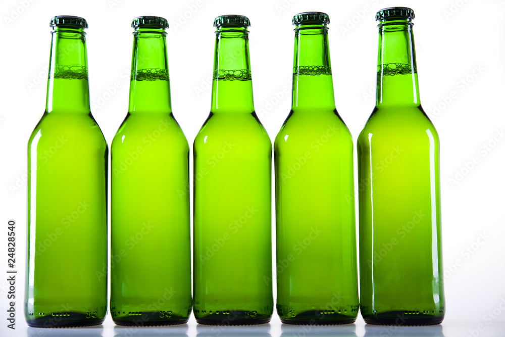 Bottles of beer against a white background Bottles of beer against a white background