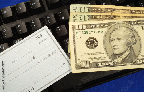 Cash and check on a keyboard concepts of making money online