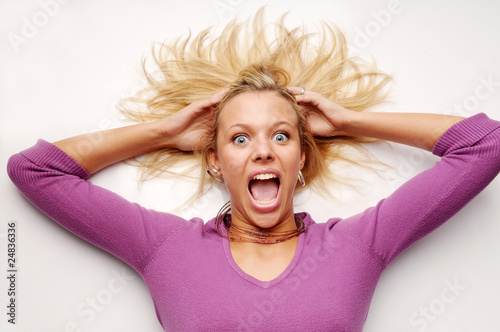 Atractive blonde woman in violet sweater