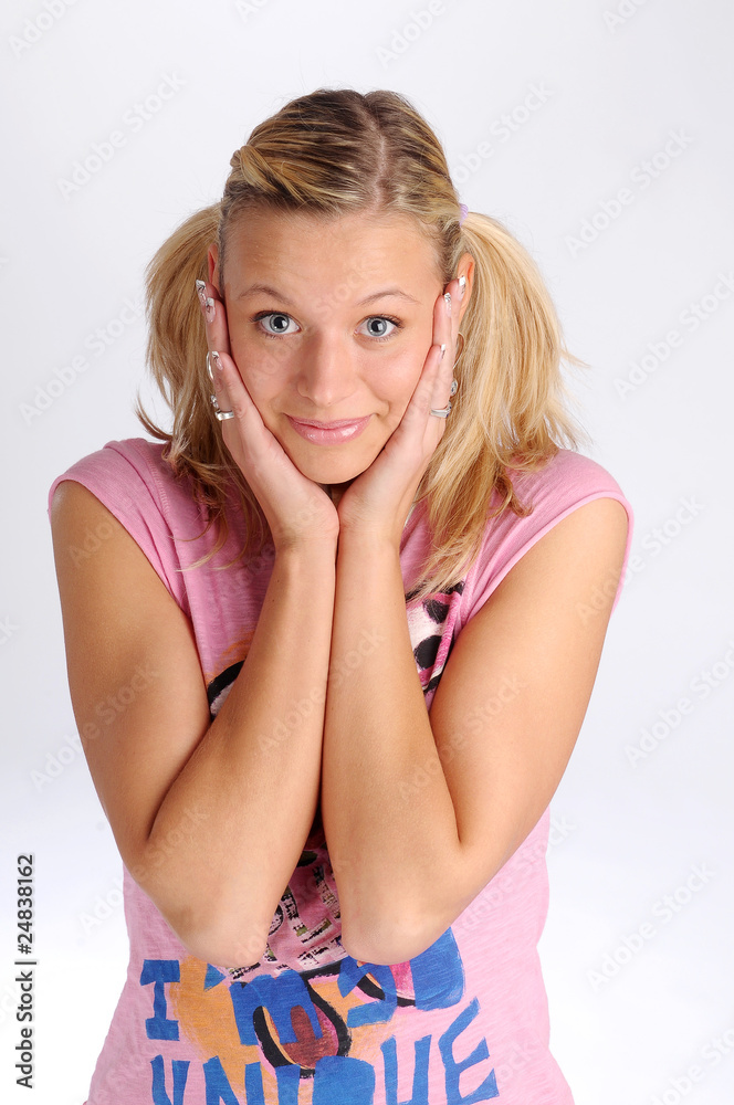Atractive blonde woman in pink T-shirt with two plaits Atractive blonde woman in pink T-shirt with two plaits