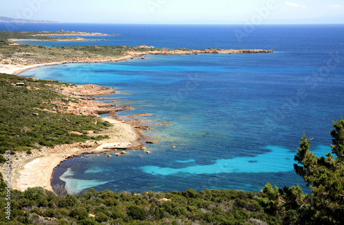 Colorful sea in sunny day in Corsica in France © Elena Kovaleva