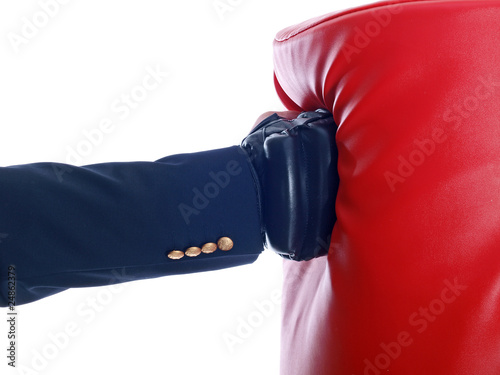 businessman wearing boxing gloves punching a bag © Lucky Dragon USA