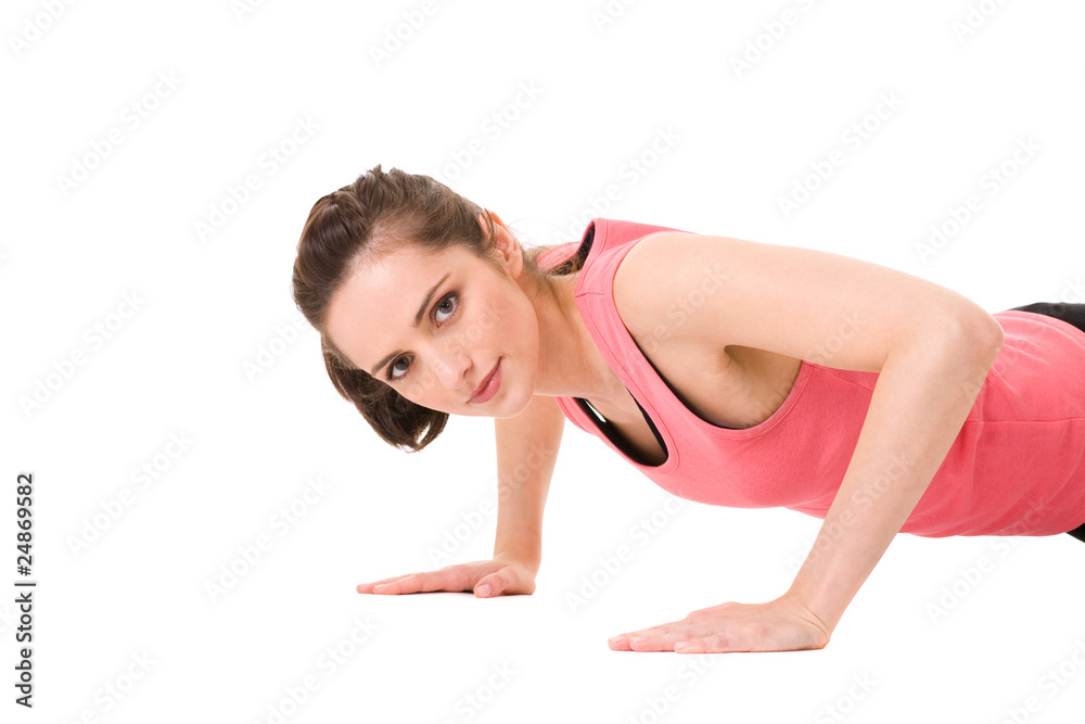young female doing some exercises on white floor, isolated young female doing some exercises on white floor, isolated