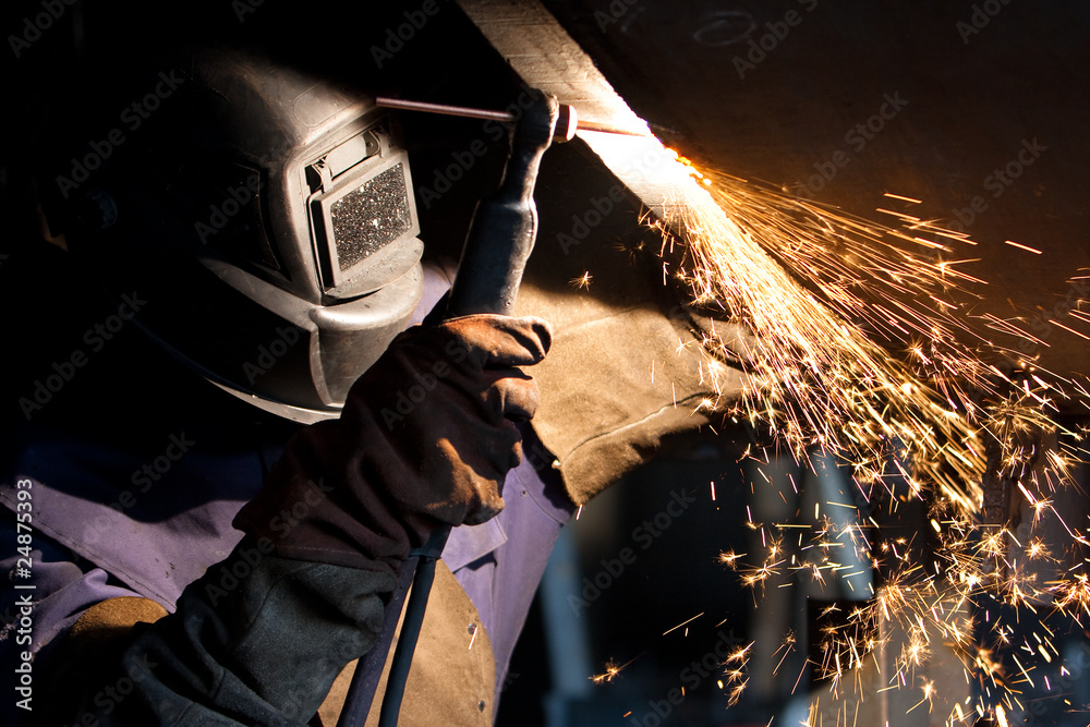 worker weld metal in factory and sparks worker weld metal in factory and sparks