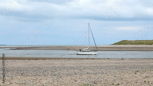 yacht drifting along a channel