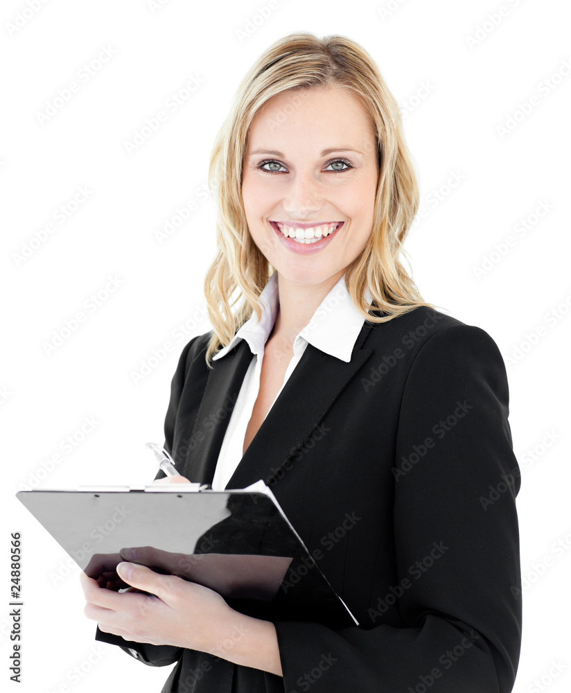 Glowing young businesswoman taking notes on her clipboars Glowing young businesswoman taking notes on her clipboars
