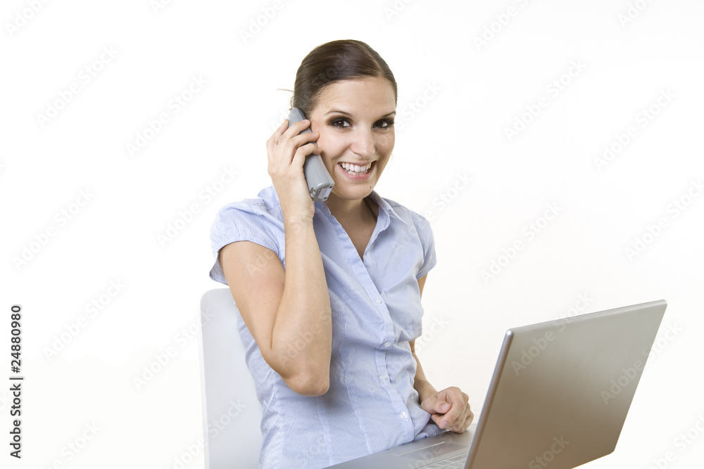 happy business female with laptop on the phone happy business female with laptop on the phone