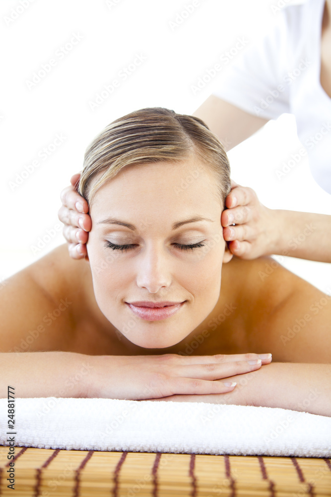 Radiant young woman receiving a head massage