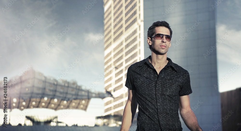 Young handsome man over urban background Young handsome man over urban background