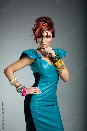 Fasion Girl in a Green-Blue Dress and Penk hair