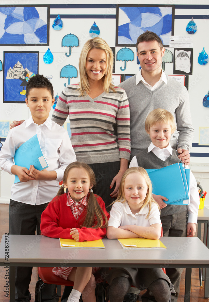 Portrait Of Group Of Primary Schoolchildren And Teachers Sitting Portrait Of Group Of Primary Schoolchildren And Teachers Sitting