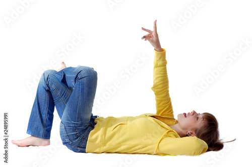 Lying young girl showing to up