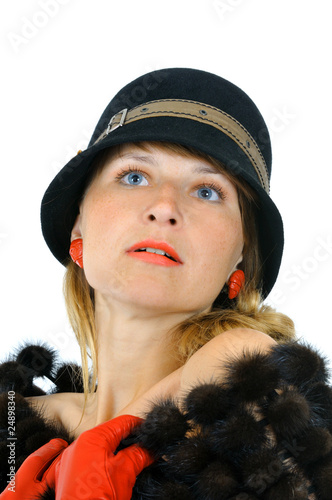 portrait of pretty girl in hat and red gloves