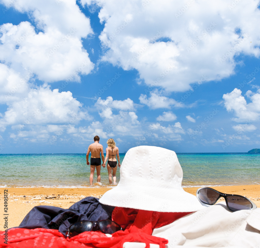 A couple walking together on the beach