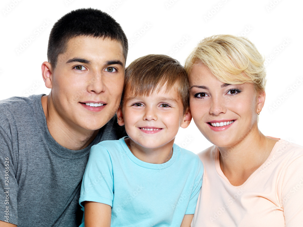 Happy faces of young smiling family - On white background Happy faces of young smiling family - On white background