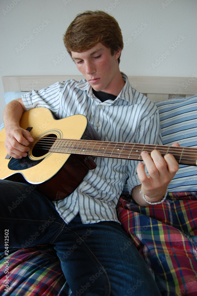 Obraz premium Young Man Playing Guitar