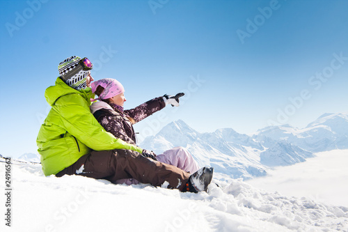 Young happy couple in winter mountains