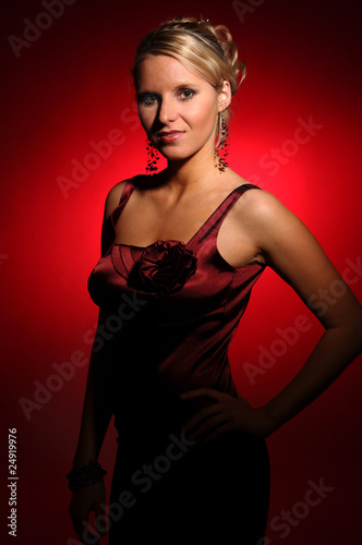 The beautiful woman in the satin red dress