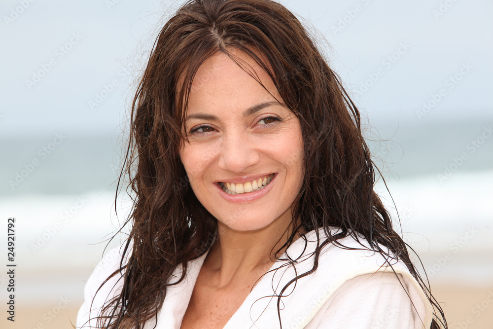 Happy woman on the beach during spa treatment Happy woman on the beach during spa treatment