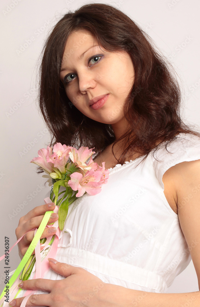 Portrait of pregnant woman in white dress with flower Portrait of pregnant woman in white dress with flower