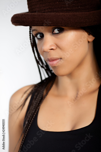 Afro american model wearing a hat in light background