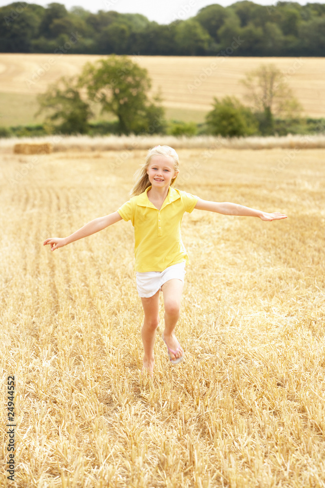 Girl Running Through Summer Harvested Field Girl Running Through Summer Harvested Field
