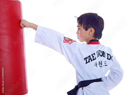 child practicing martial arts isolated on white background