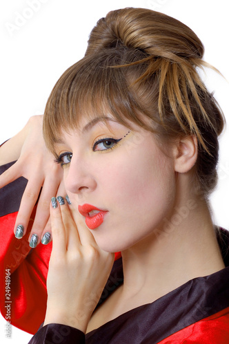 Portrait of beautiful smiiling girl in kimono with painted nails