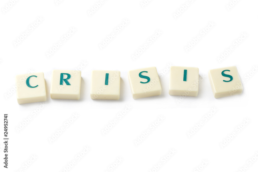 Obraz premium crisis word from scrabble letters isolated on white