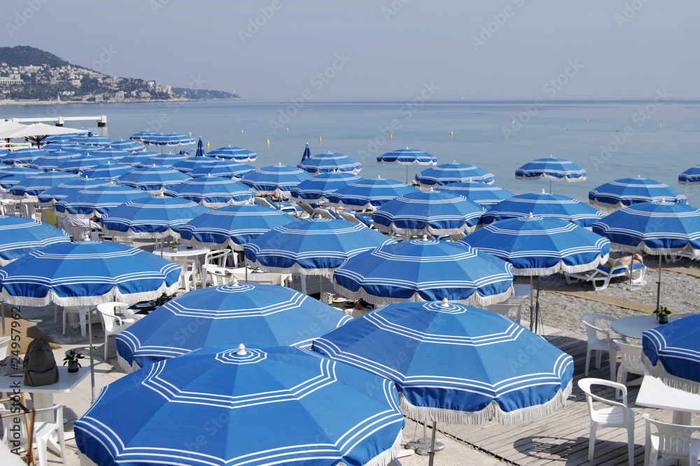 Beach umbrellas at Nice. Cote d'Azur. France