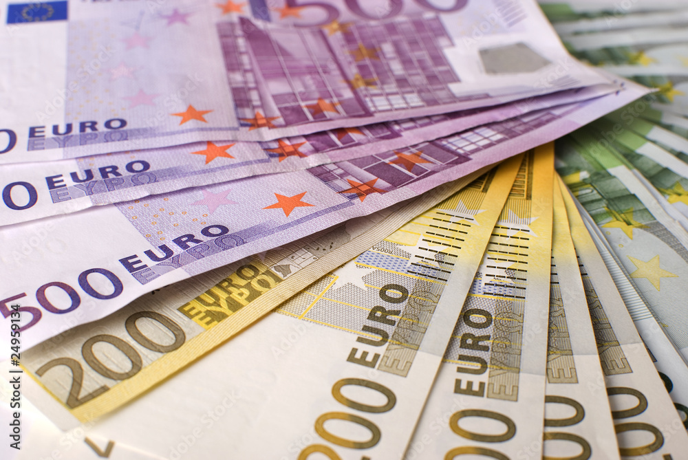 Close-up of the fan Euro banknotes and  coins.