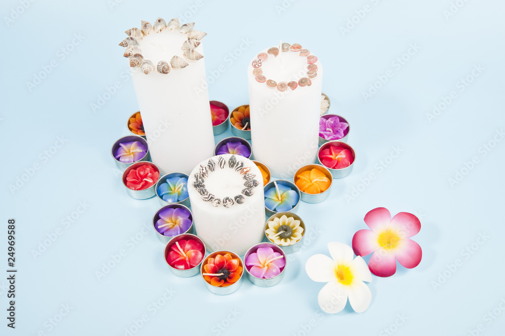 Three candles with flowers