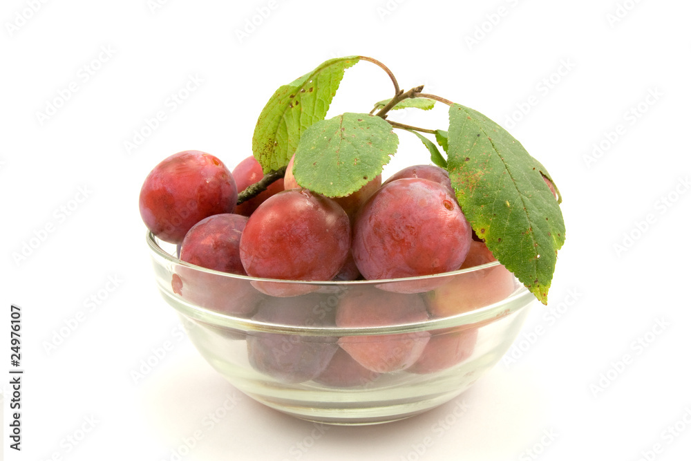 dish with plums, isolated on white background dish with plums, isolated on white background
