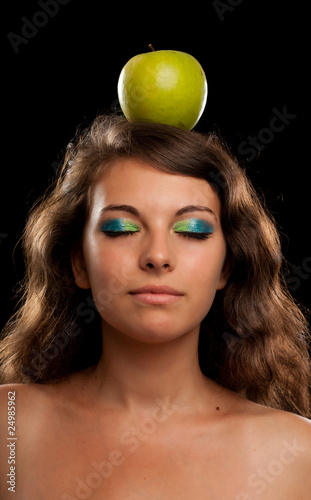 Woman with apple on head
