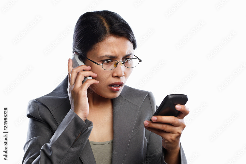 Businesswoman serious expression using video call Businesswoman serious expression using video call