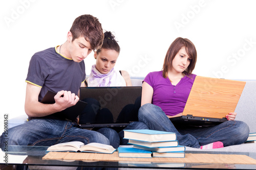 happy students looking at laptop