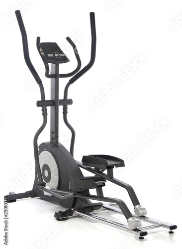 Elliptical gym machine over white background photo
