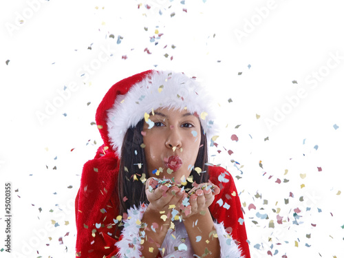 girl wearing santa hat blowing confetti © Lucky Dragon USA