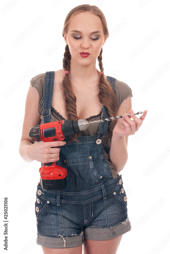 Young woman holding drill with auger Young woman holding drill with auger