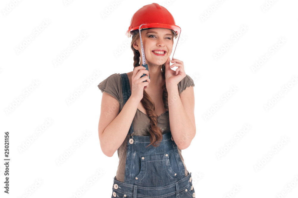Young playful worker woman holding tape measure Young playful worker woman holding tape measure