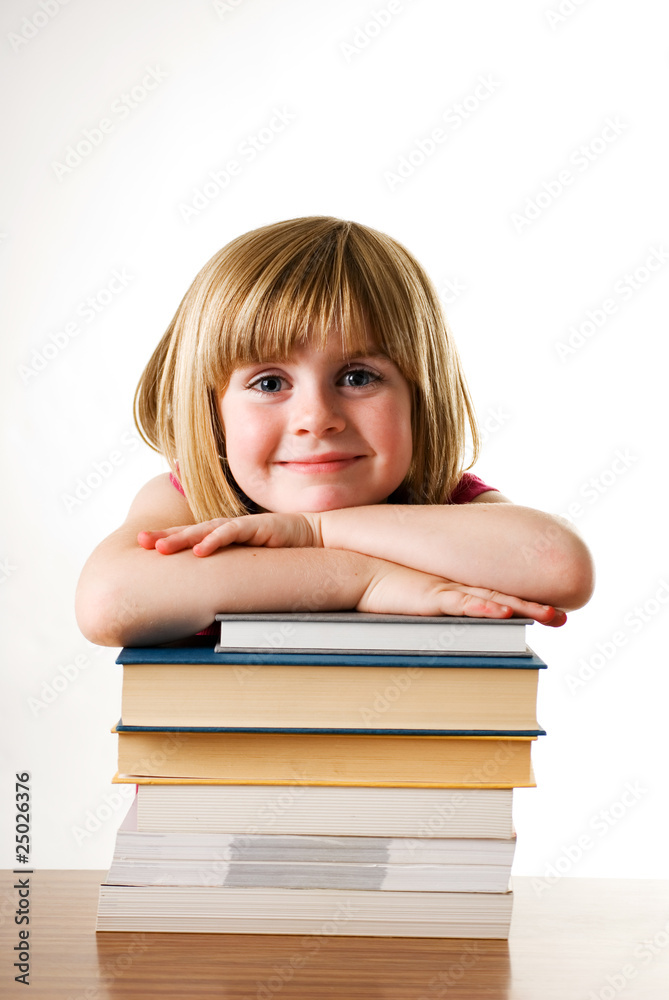 child smiling on books child smiling on books