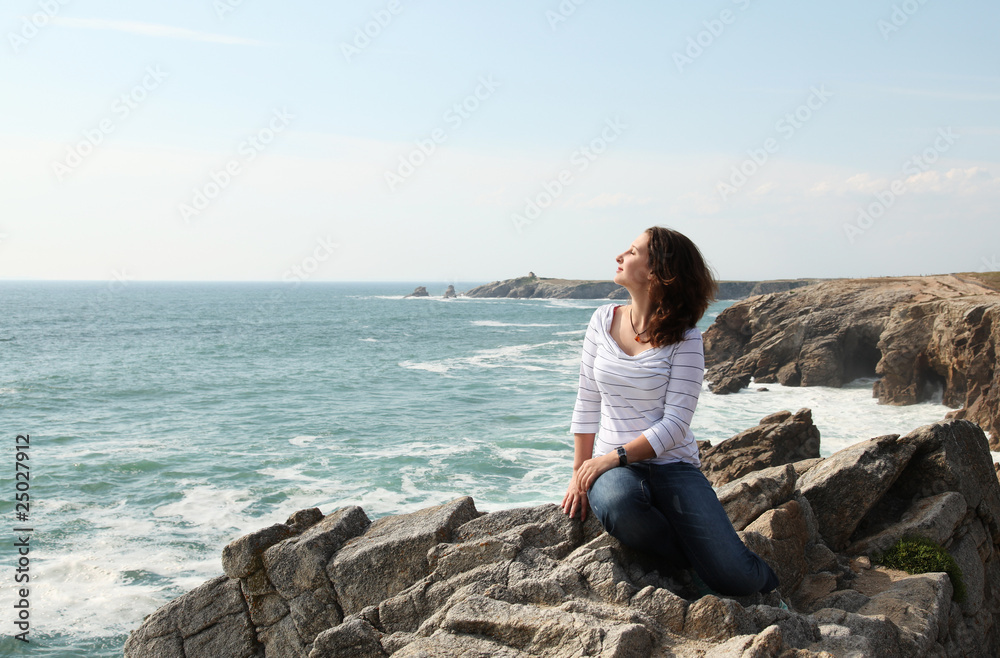 Young girl enjoying wind and the ocean Young girl enjoying wind and the ocean