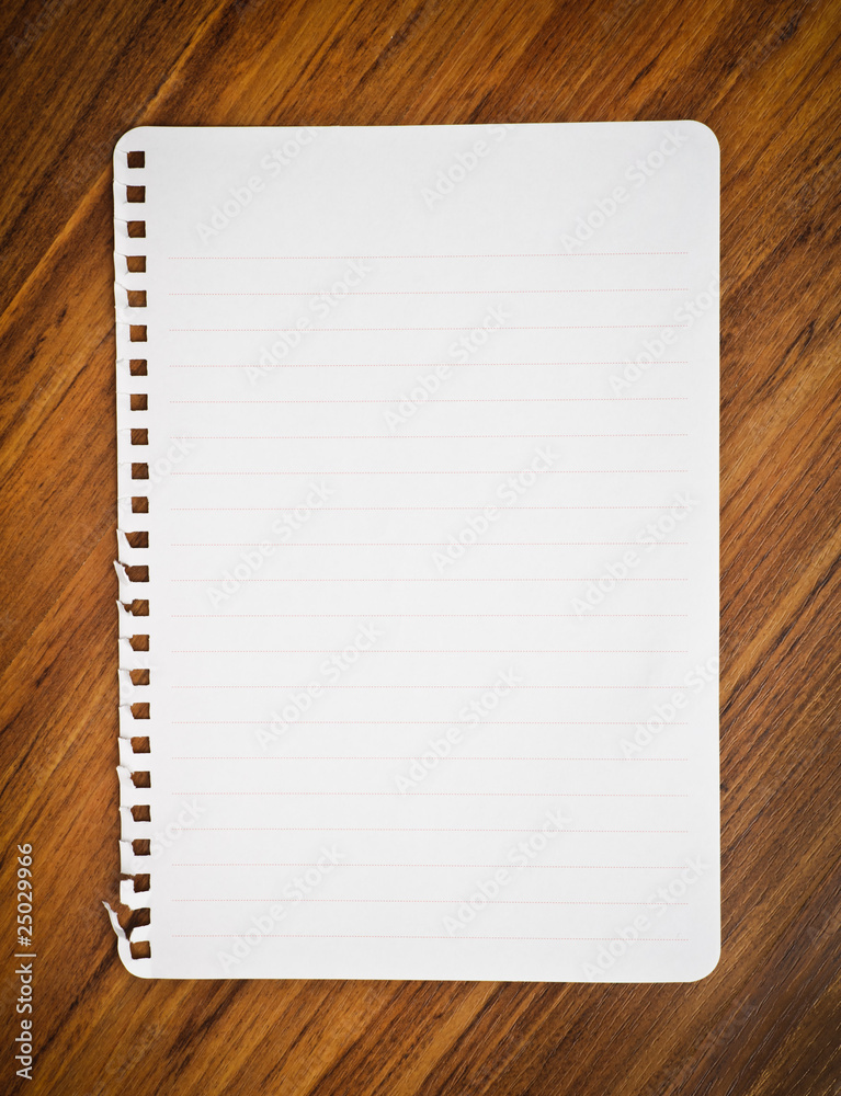notebook paper on wood floor notebook paper on wood floor
